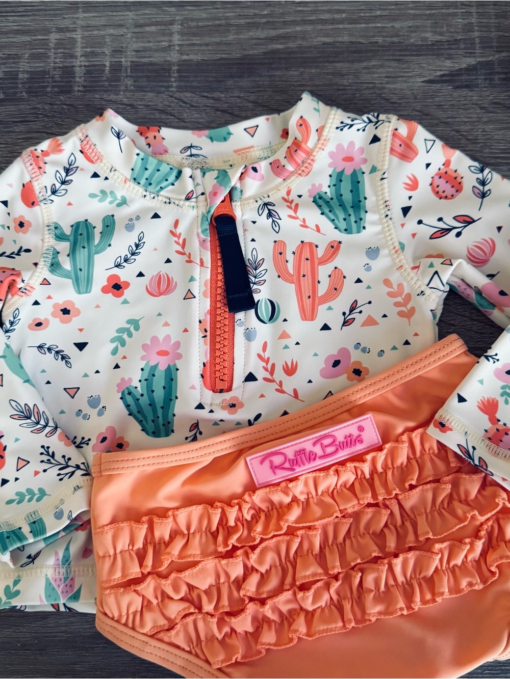 RUFFLE BUTTS |Coral Swim Bottoms with Cream Cactus Print Rashguard Size 6-12 mth